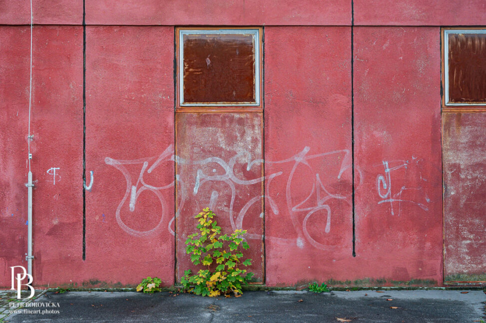 Minimalist detail of a weathered wall on an old heat exchange station in Pardubice, Czechia, featuring wabi-sabi textures, geometric shapes, and lines.